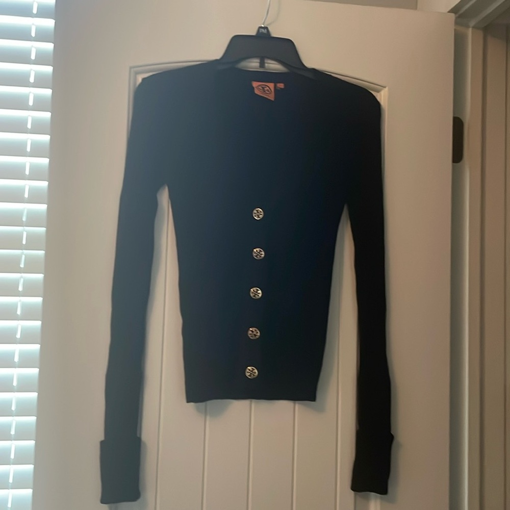 Tory Burch black merino wool v-neck cardigan w/gold toned logo buttons. Size xs